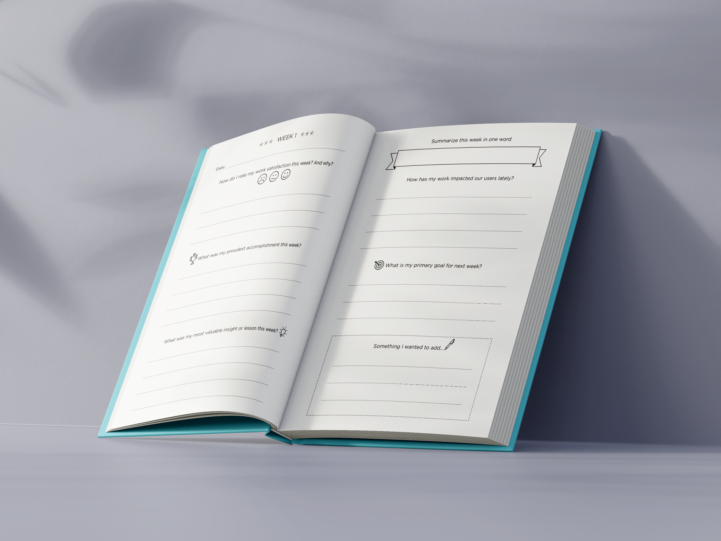 Open weekly planner notebook with handwritten prompts and lines for writing, placed on a light grey surface with shadows.