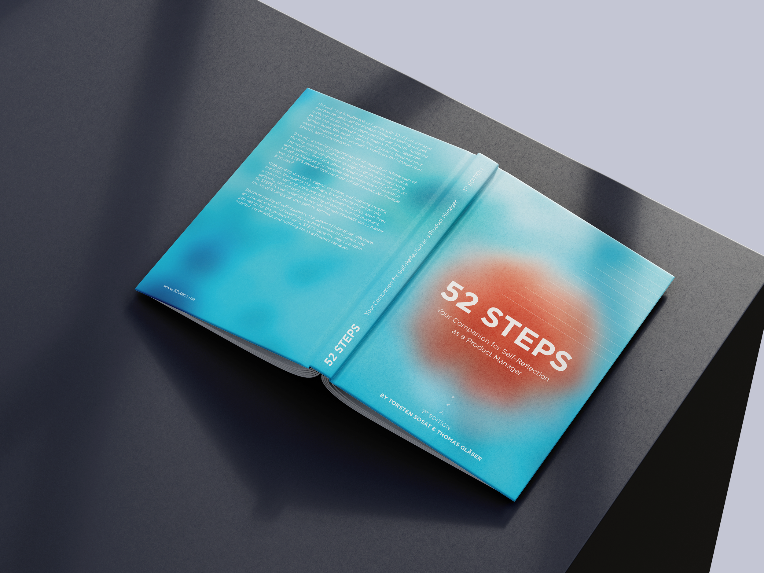 Open booklet titled '52 Steps' with subtitle 'Your Companion for Self-Reflection as a Product Manager,' lying on a dark gray table. The cover has a gradient background with a red circle in the center.
